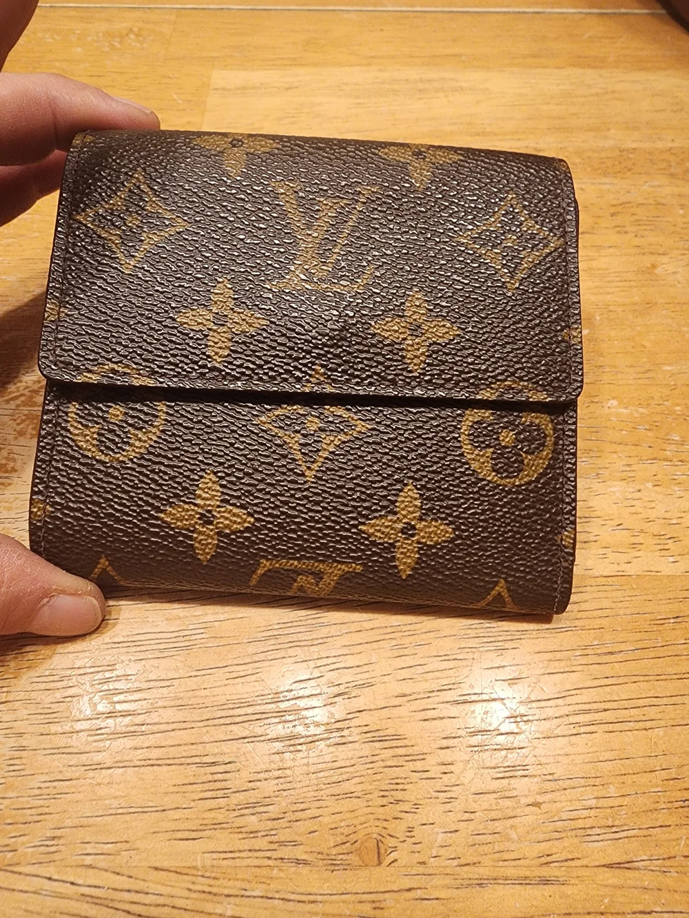 vintage Louis Vuitton Monogram Elise Wallet crafted in the classic brown LV